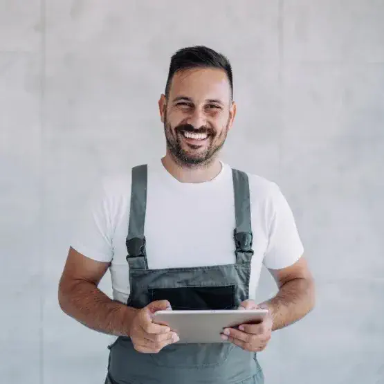 Happy guy holding a tablet